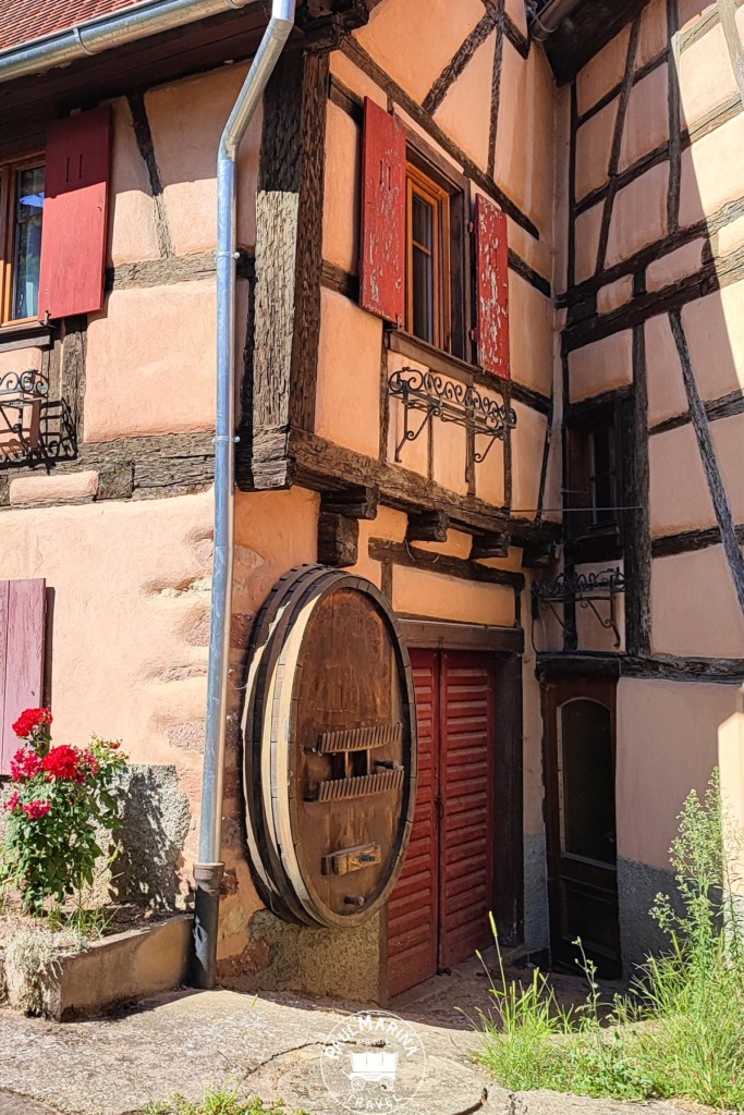 Wine barrel in a typical Alsace house wall