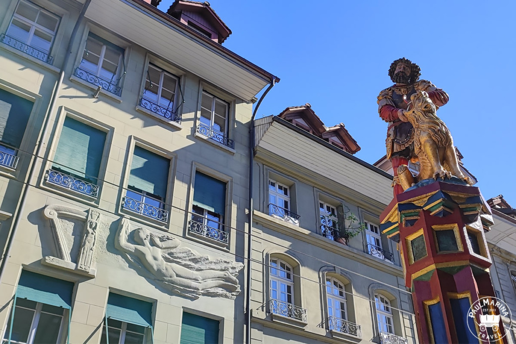 Samson fountain in Bern with wall art