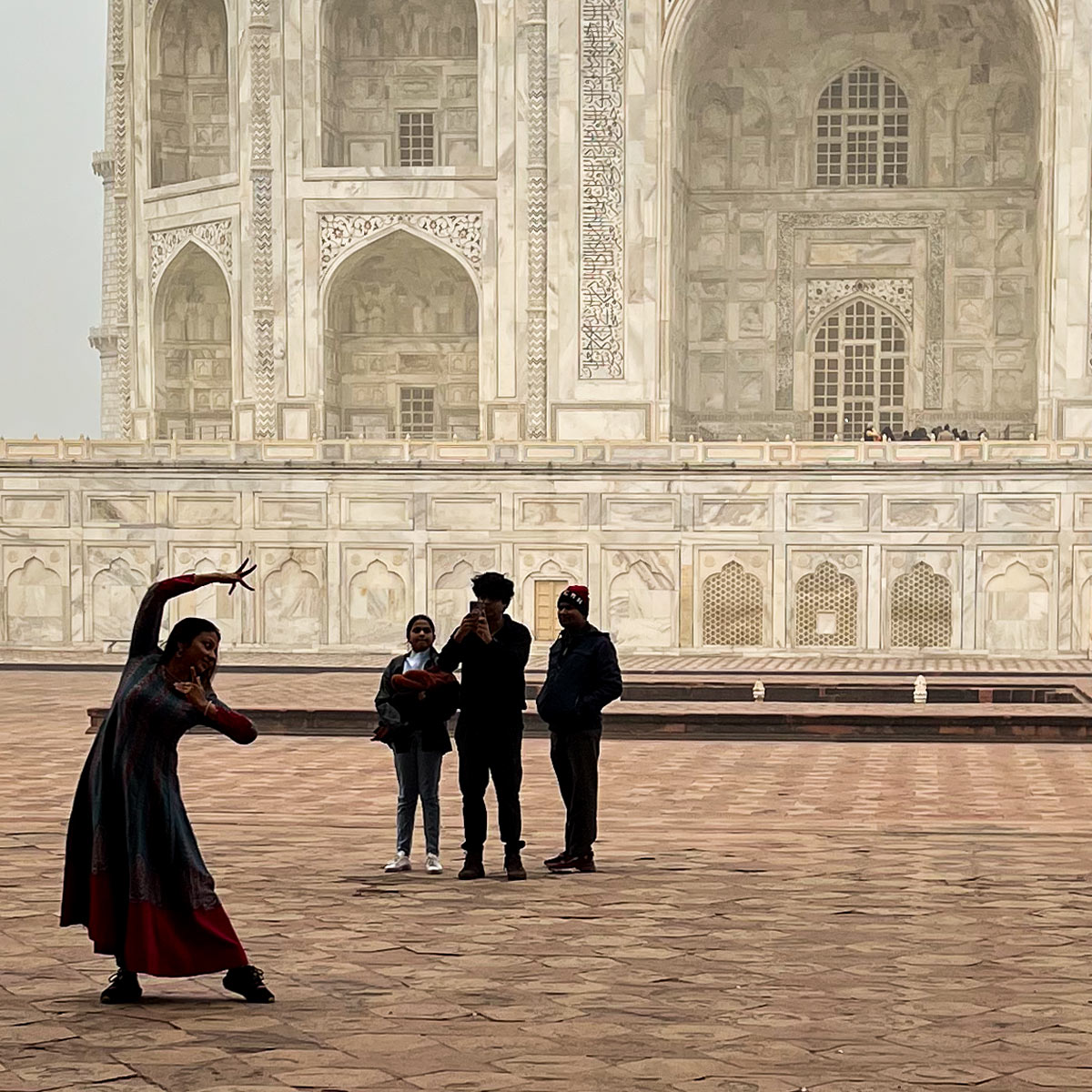 posing in front of the Taj Mahal