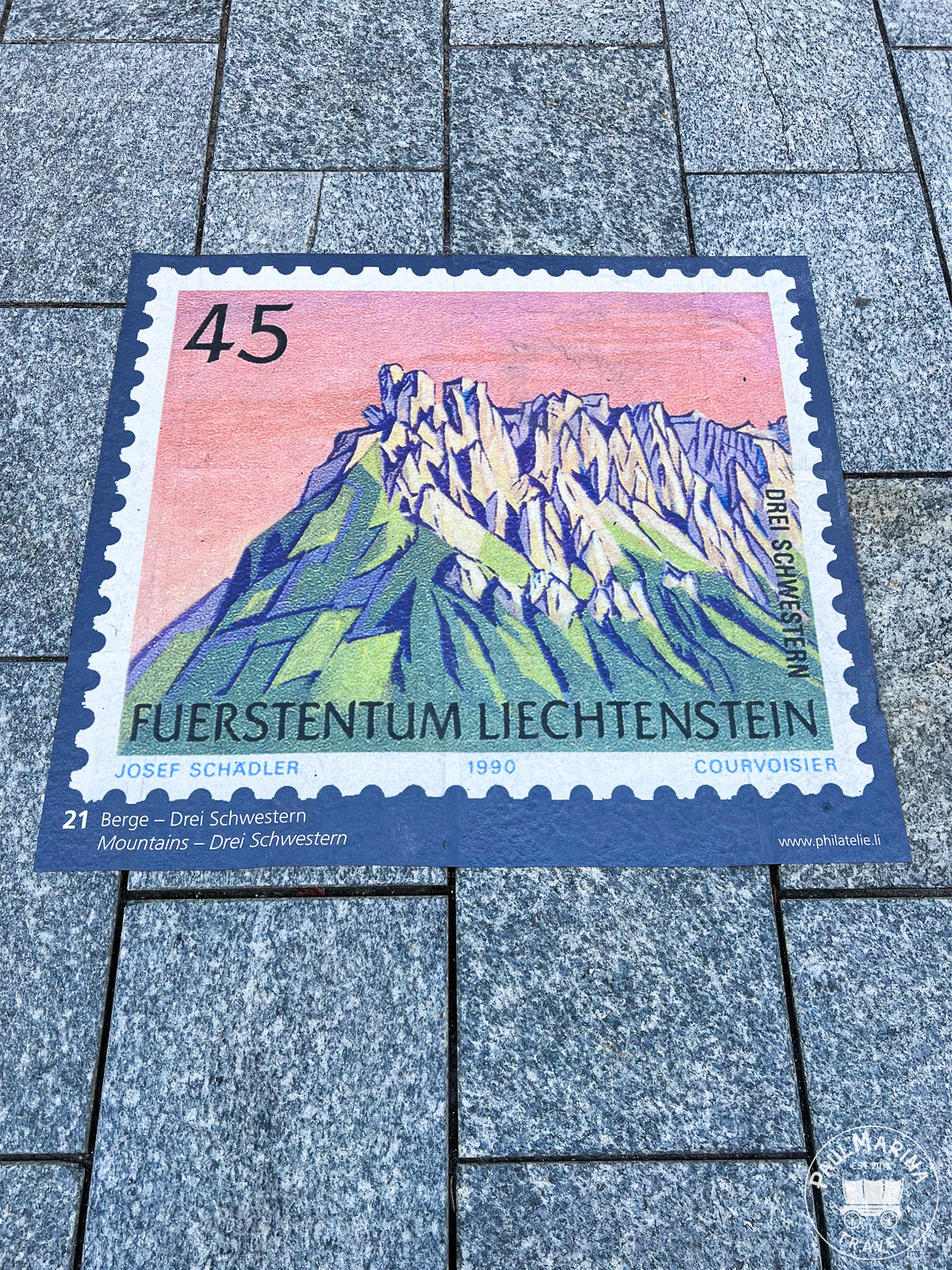 Street floor stamp showing the Drei Schwestern mountain summits