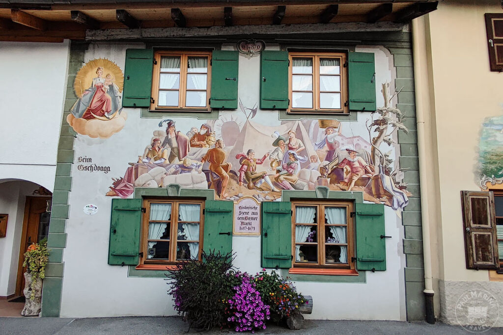 Mural depicting a South Tyrol Bolzano market scene in Mittenwald
